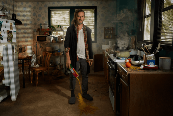 man standing in kitchen